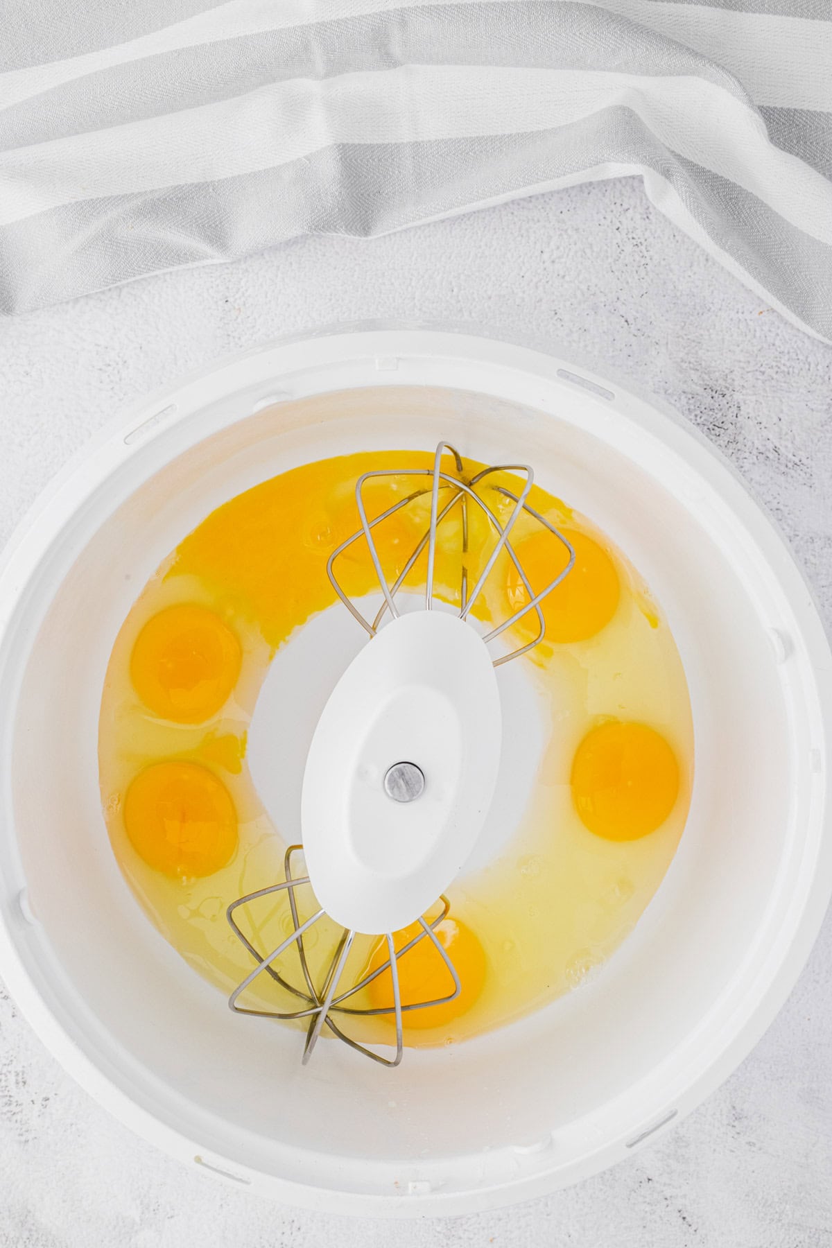 Mixing eggs to make a the bread pudding custard.