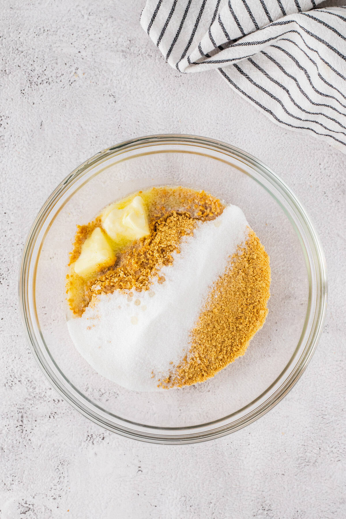 Making the homemade graham cracker crust.