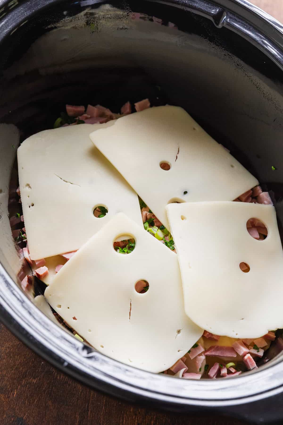 A layer of swiss cheese slices.