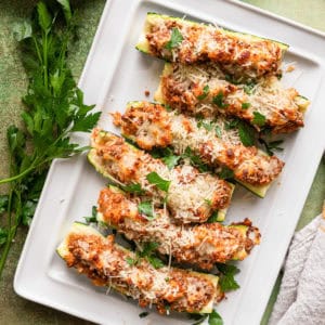 Stuffed zucchini with ground beef and melted cheese.
