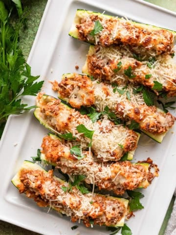 Stuffed zucchini with ground beef and melted cheese.