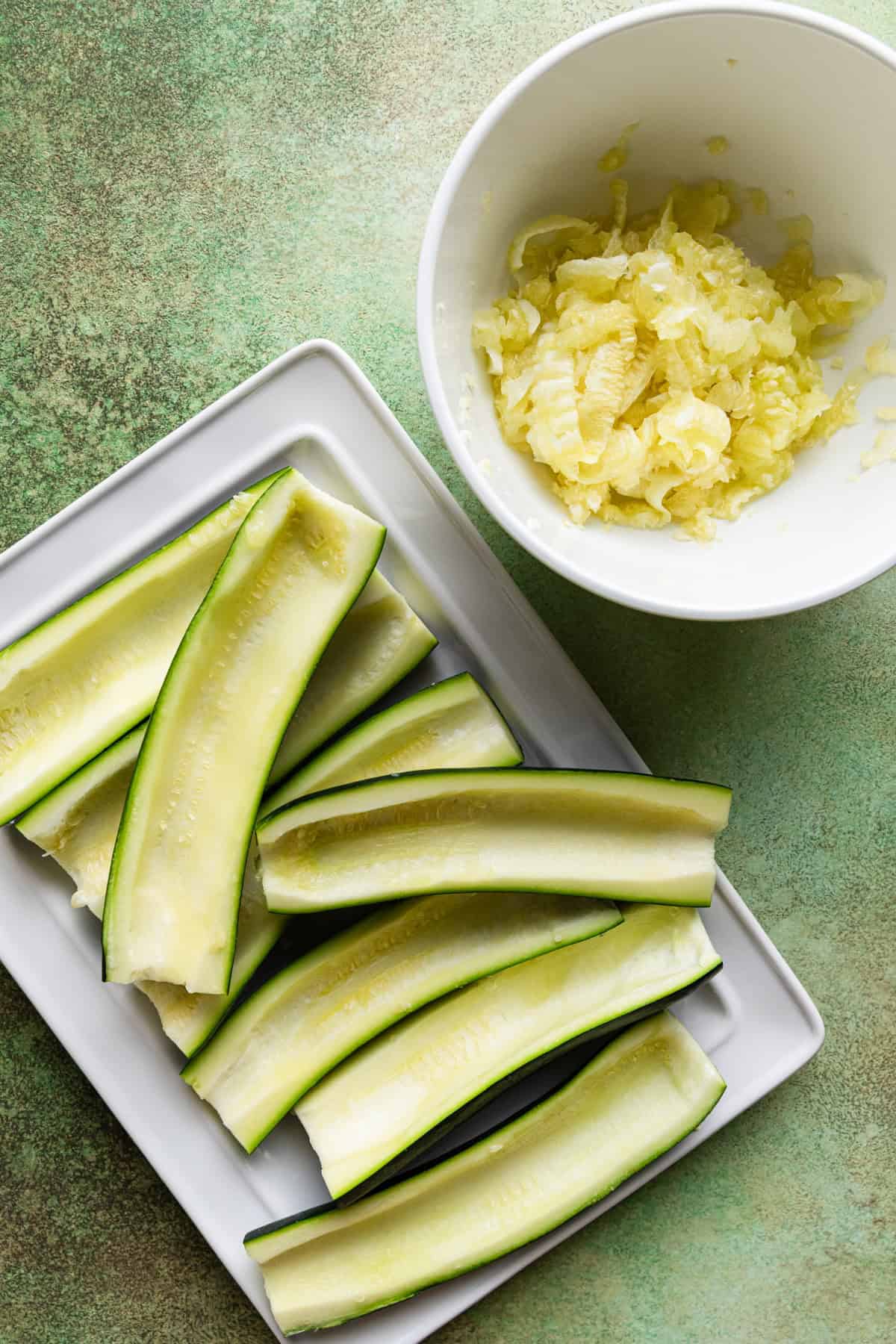 Zucchini with the seeds scooped out.