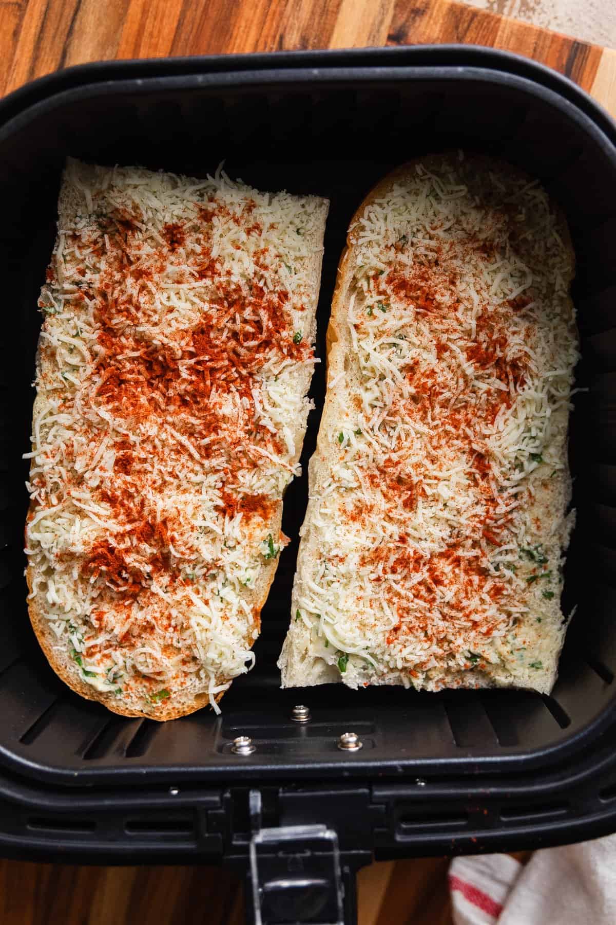 Bread slices in the air fryer basket.