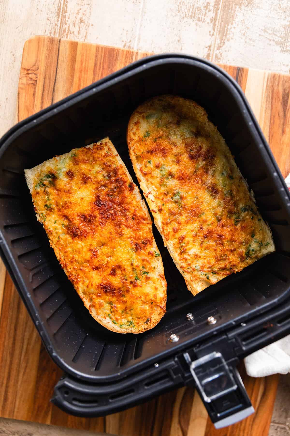 The cooked garlic bread in the basket.