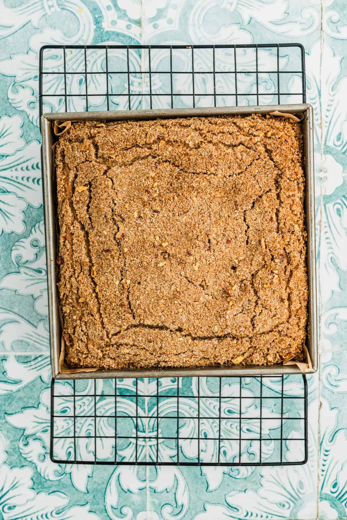 The baked coffee cake on a cooling rack.
