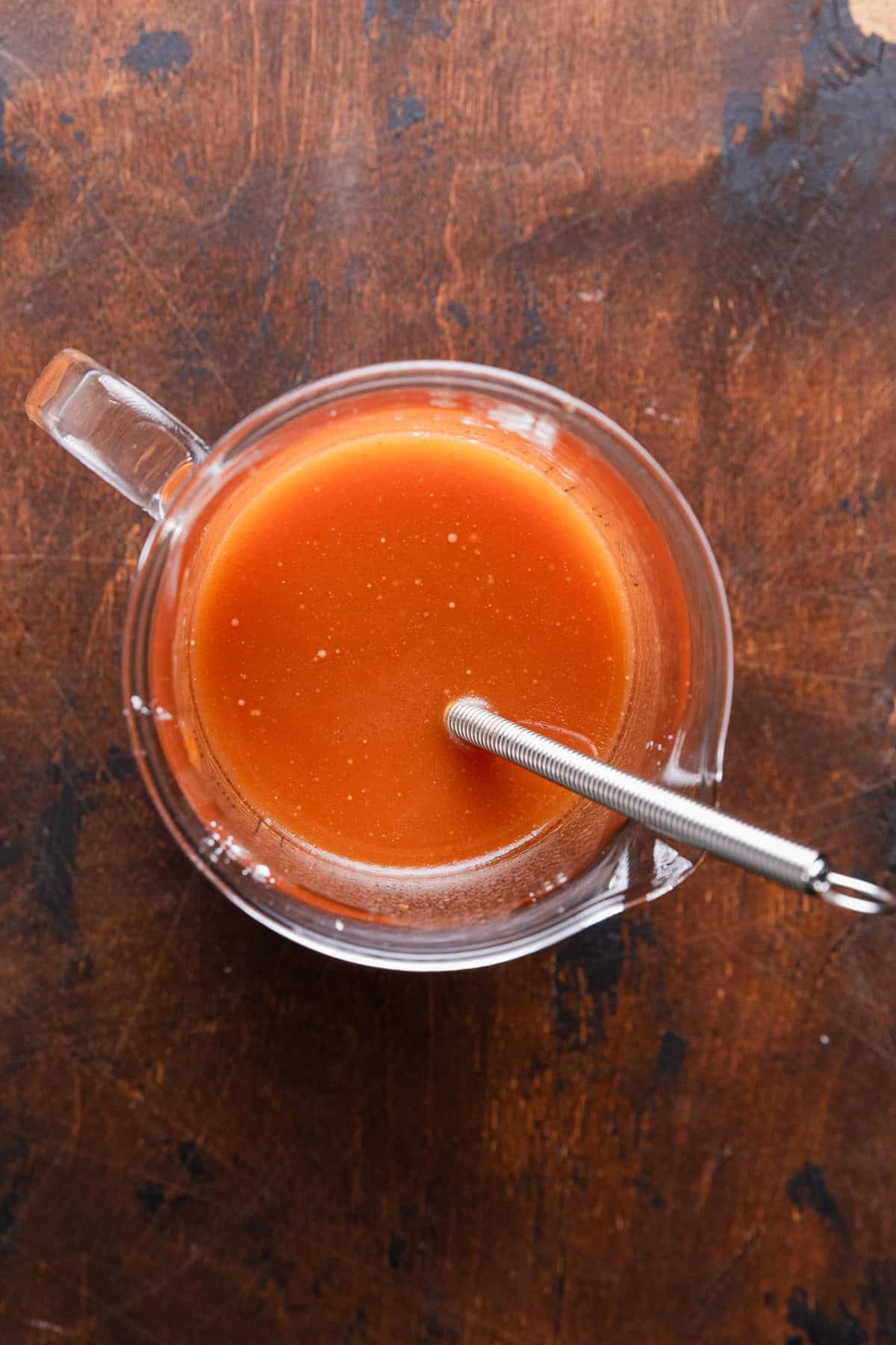 Mixing orange sauce.