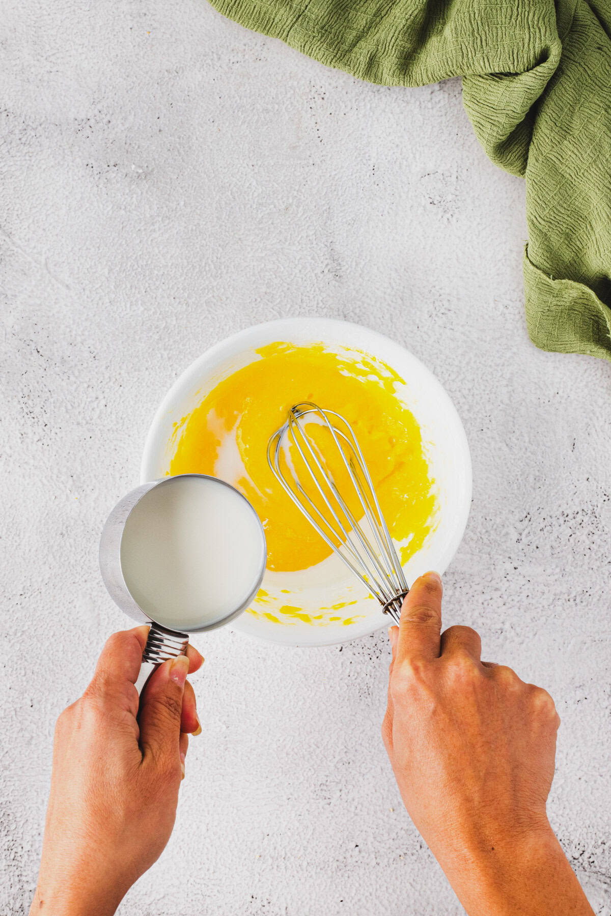 Adding milk to make the pie custard.