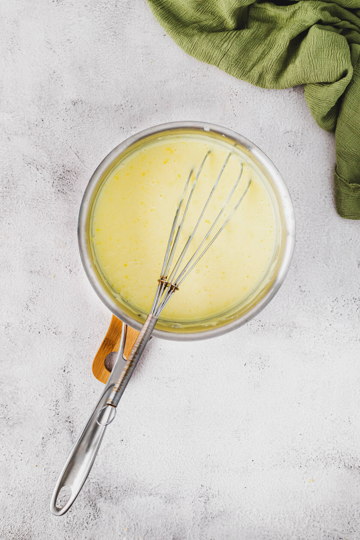 Simmering the pudding mixture.