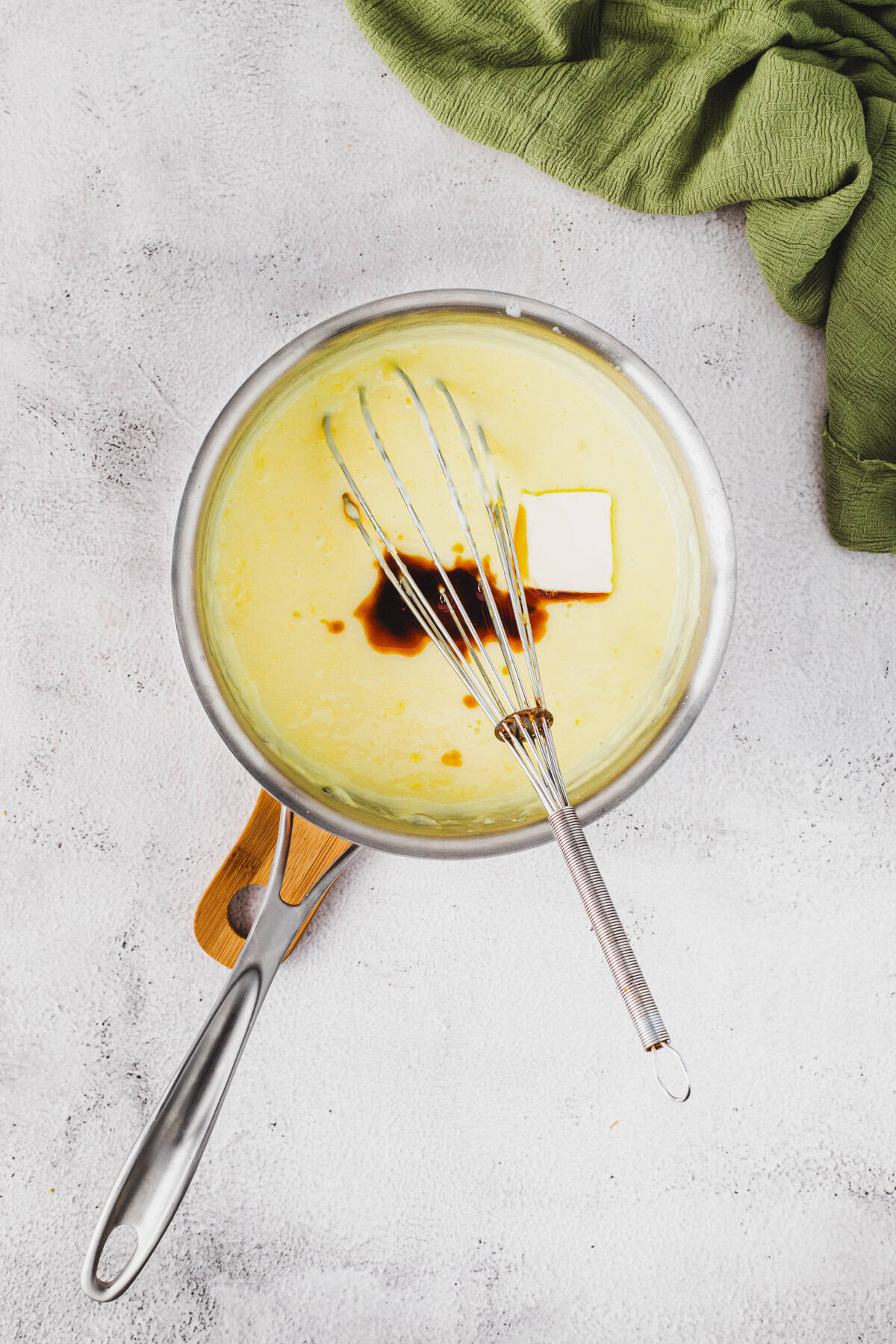 Adding vanilla and butter to make the pudding layer.