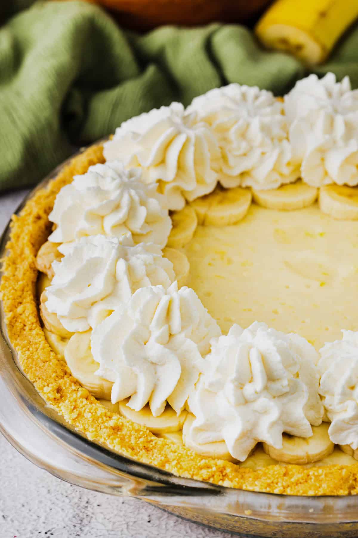 No bake banana cream pie with piped whipped cream.