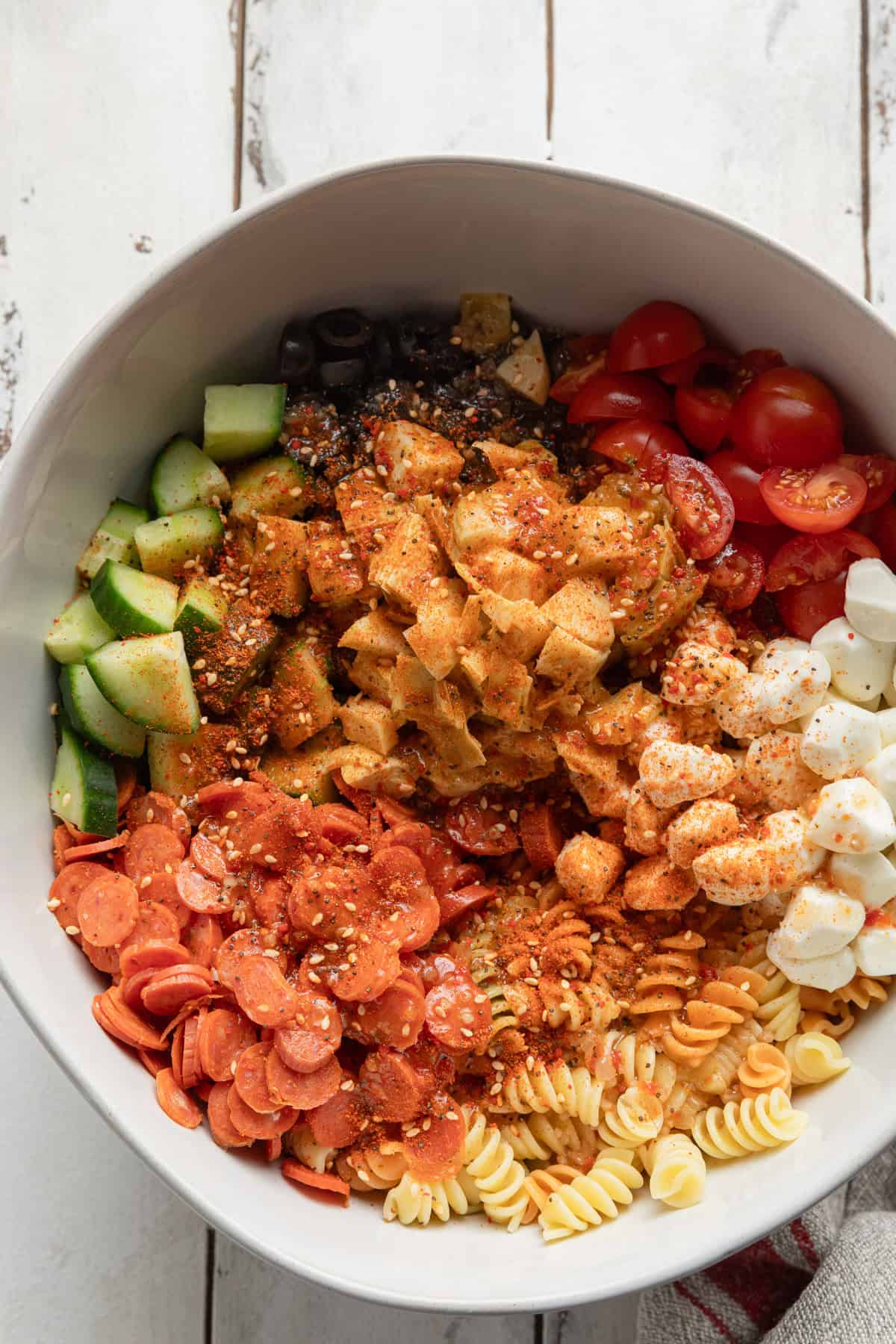 Adding salad supreme seasoning blend the ingredients.