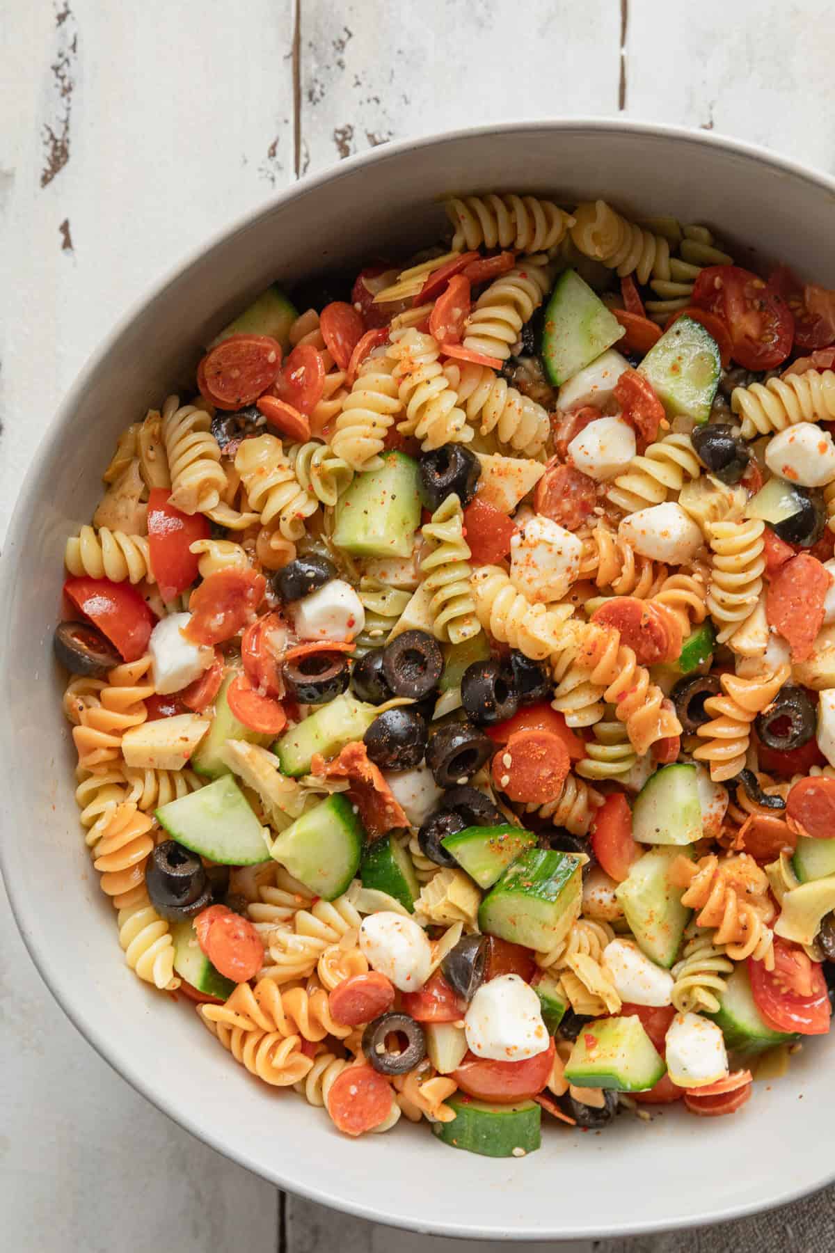 The pasta salad mixed in a bowl.
