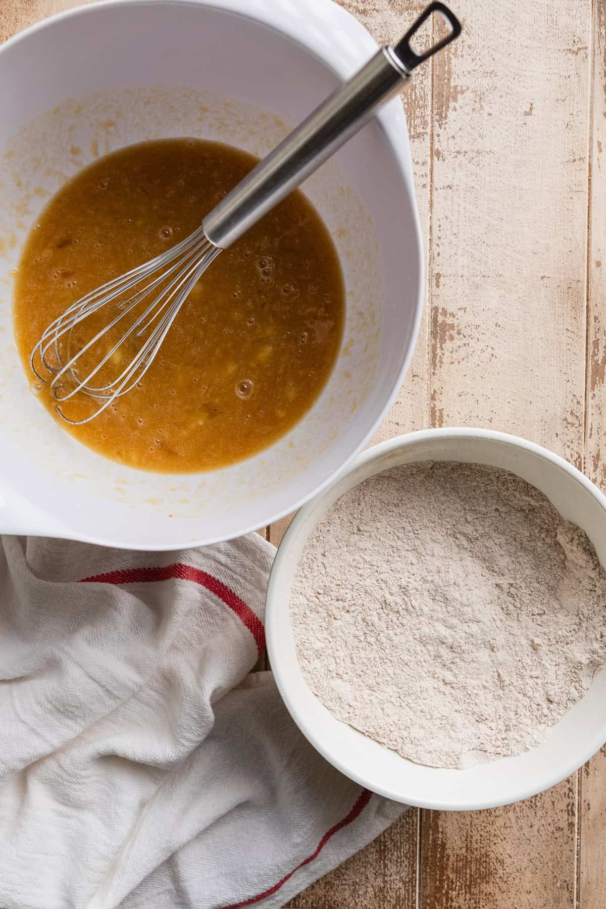 The wet and dry ingredients in separate bowls.