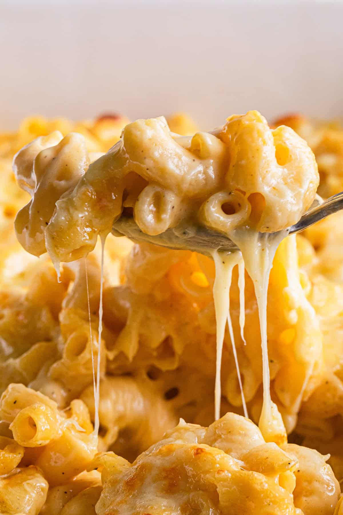 The completed baked mac and cheese scooped out of the dish.