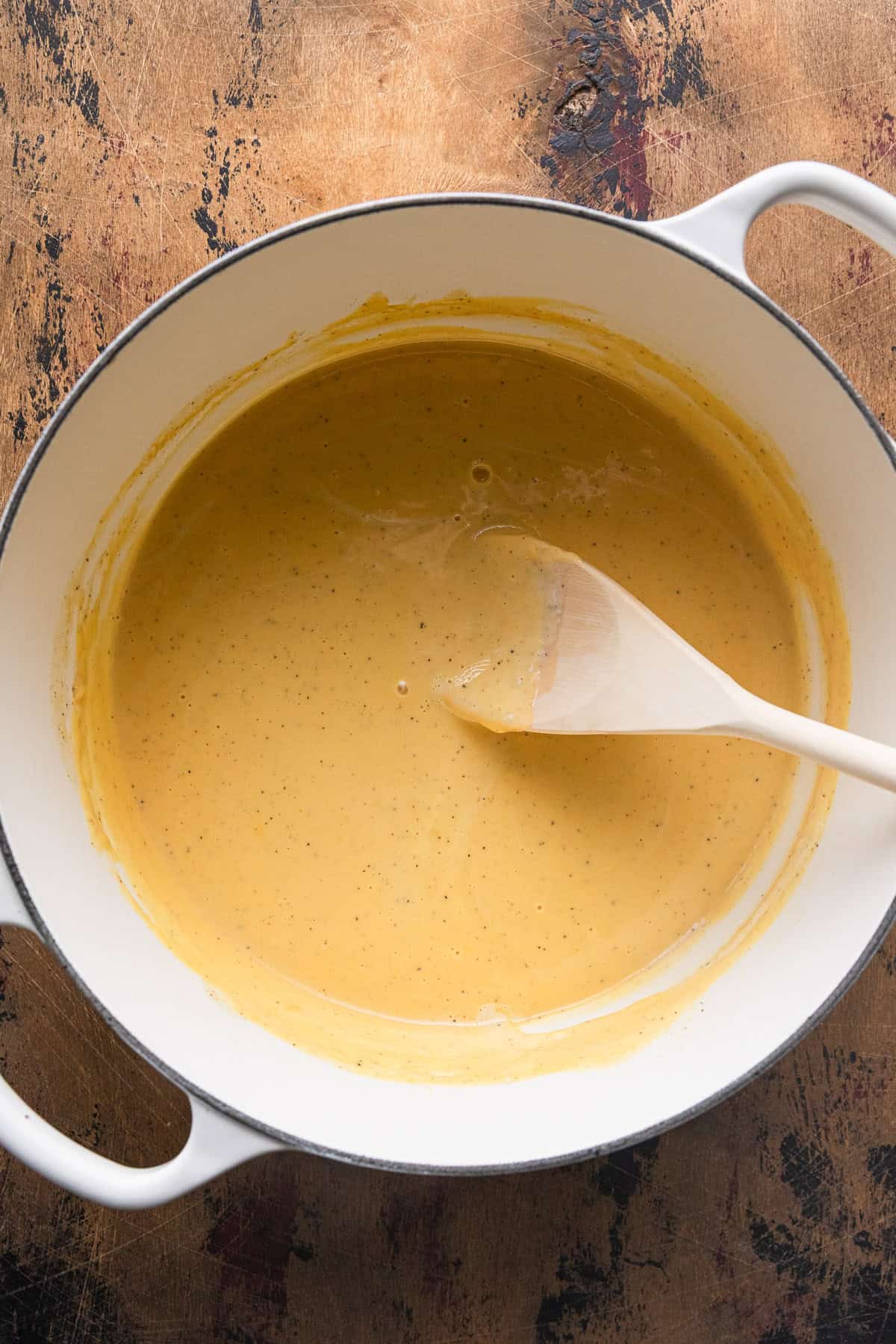 Making a creamy sauce of velveeta.