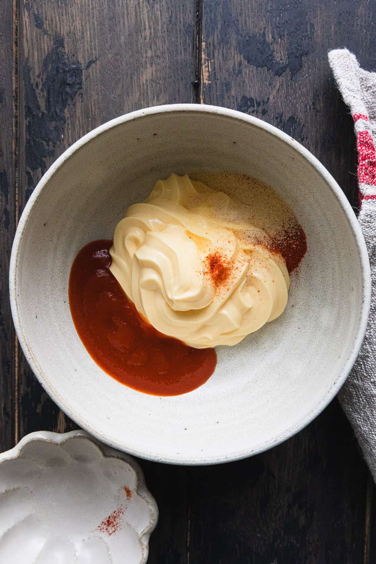 Making the sriracha cream sauce.