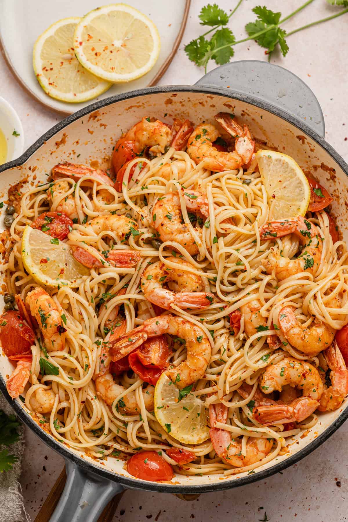 The completed shrimp and linguine cooked in caper, butter, tomato and wine sauce.