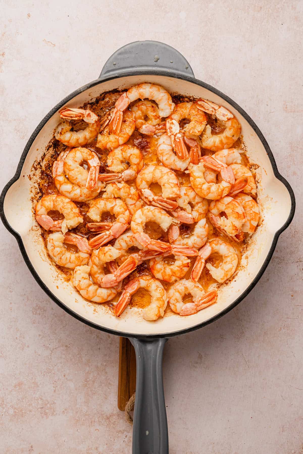 Cooking shrimp in a skillet.