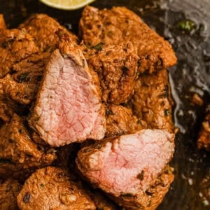 Brazilian steak bites cooked to medium doneness.