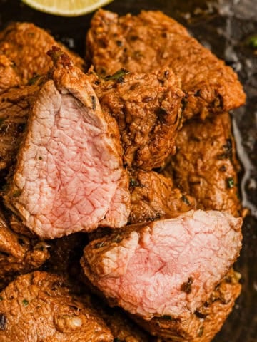 Brazilian steak bites cooked to medium doneness.