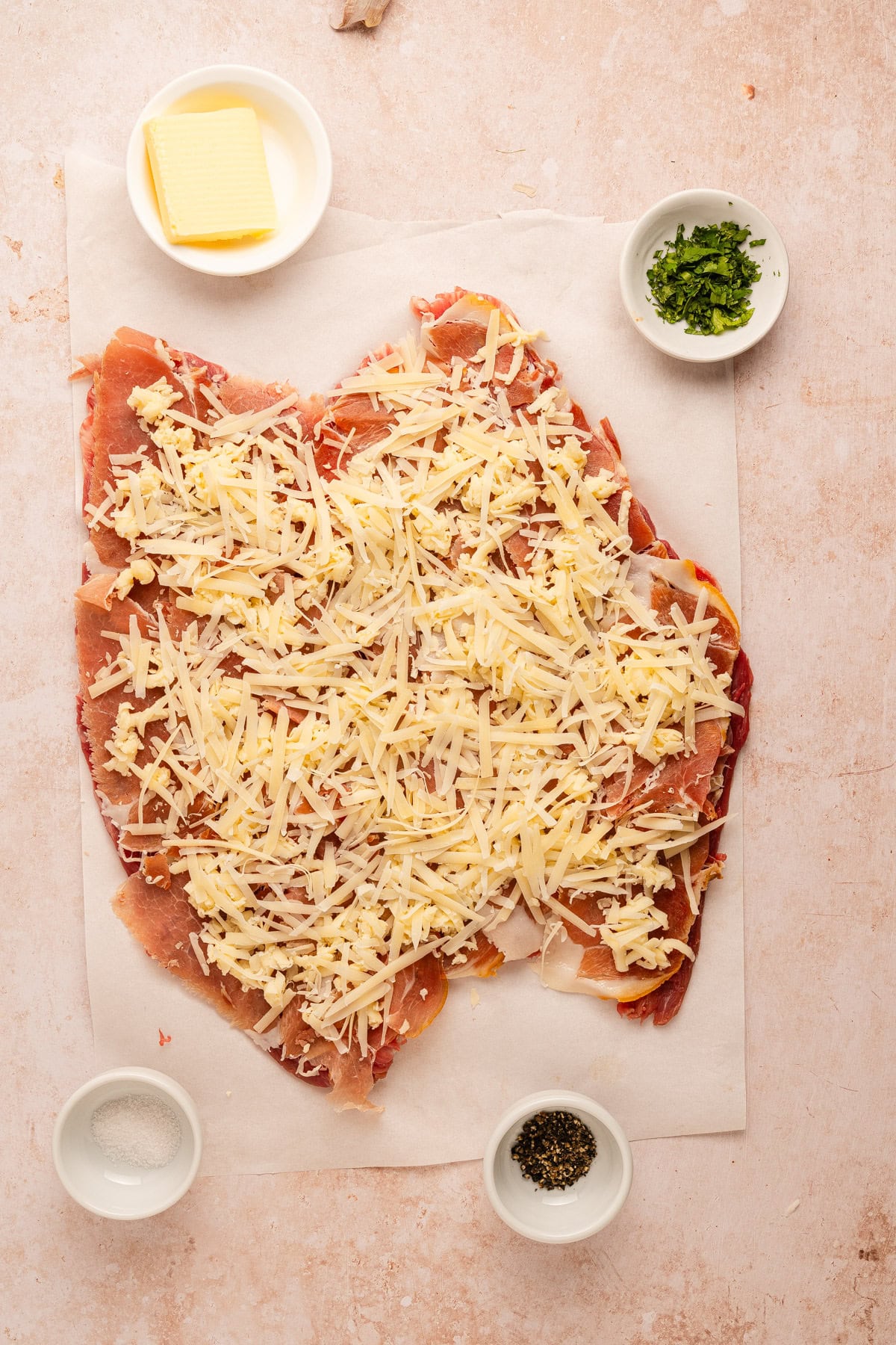 Layers of cheese on flank steak.