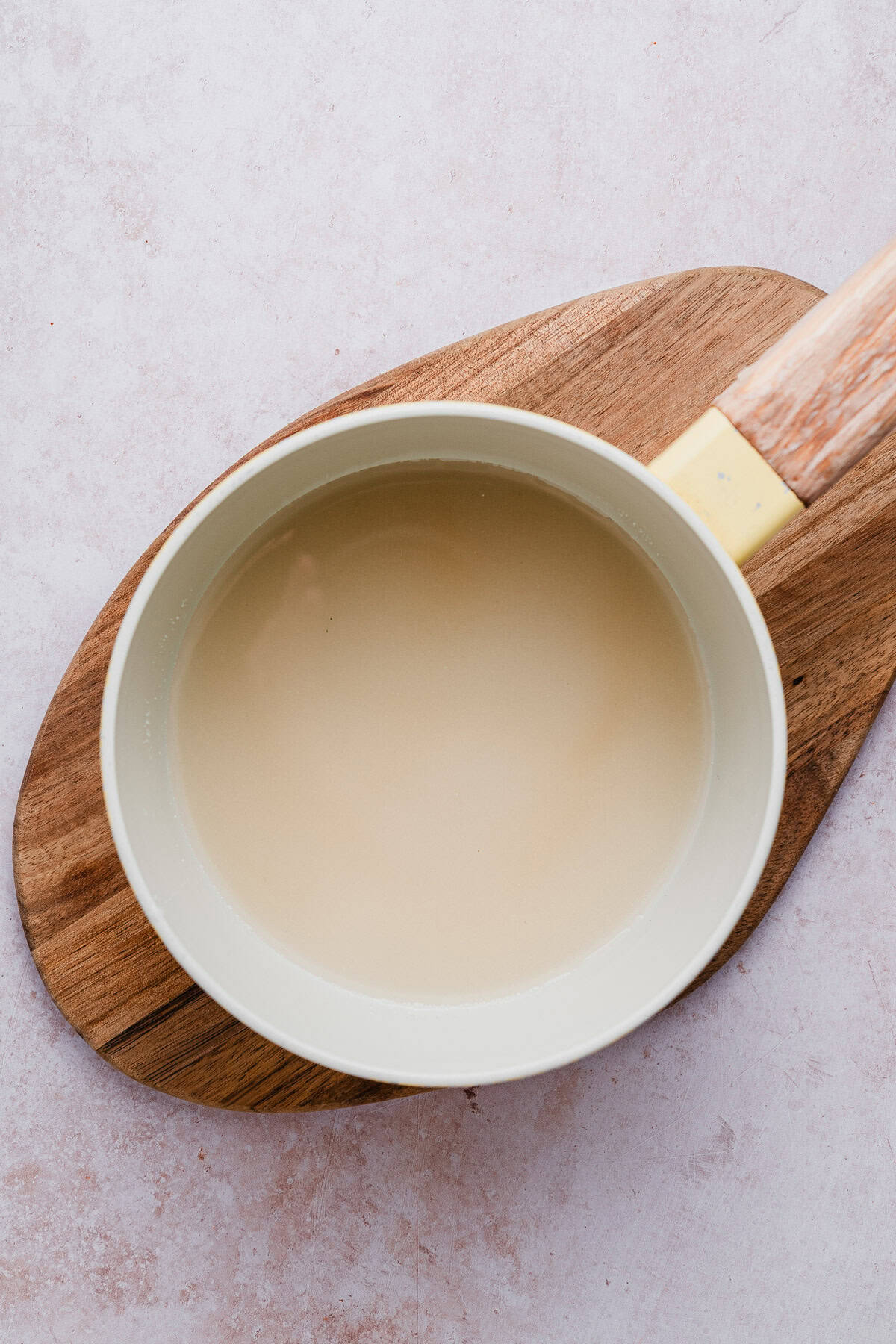 Sugar and water in a saucepan.