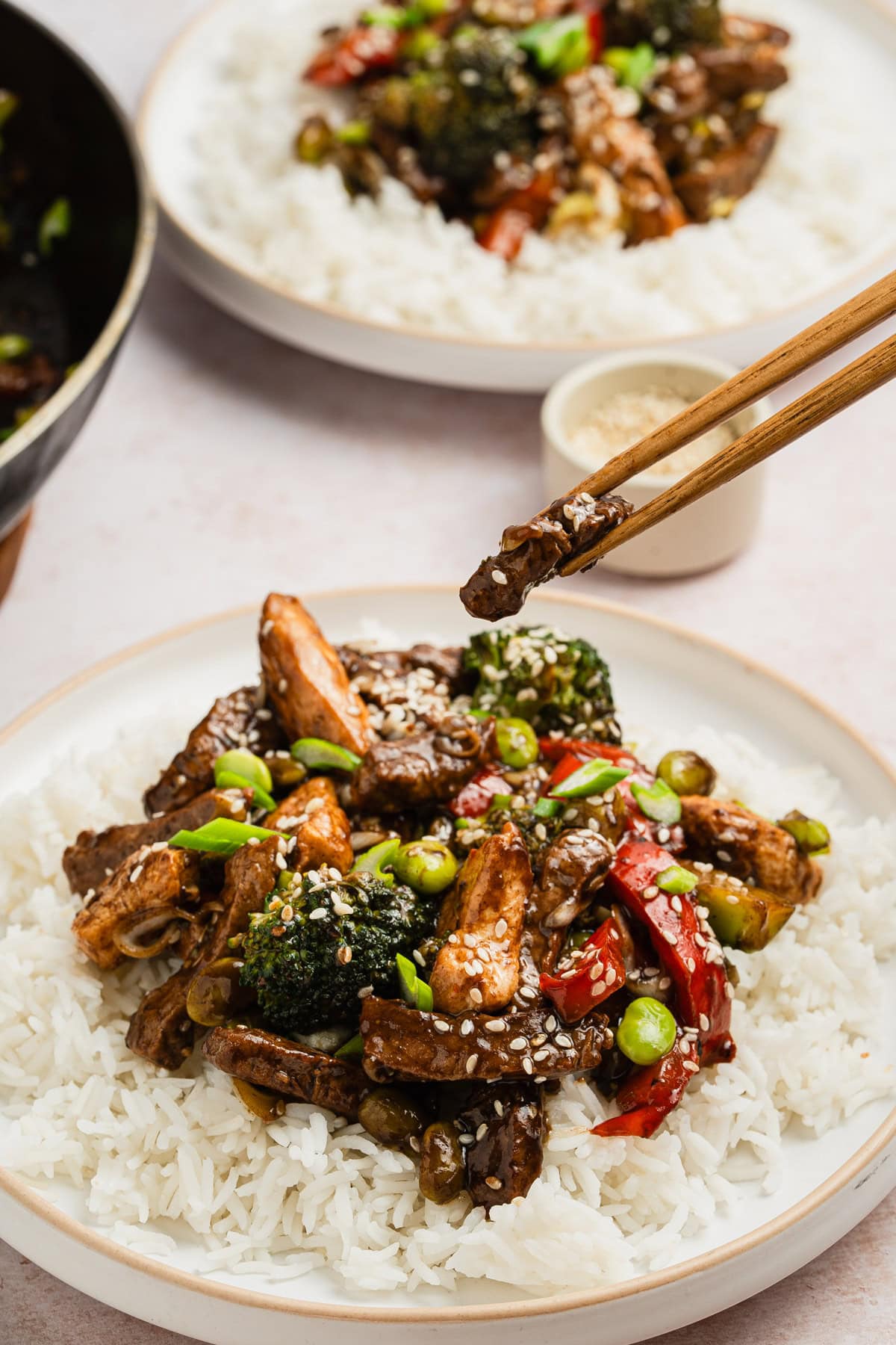The completed recipe served on a plate with chopsticks.