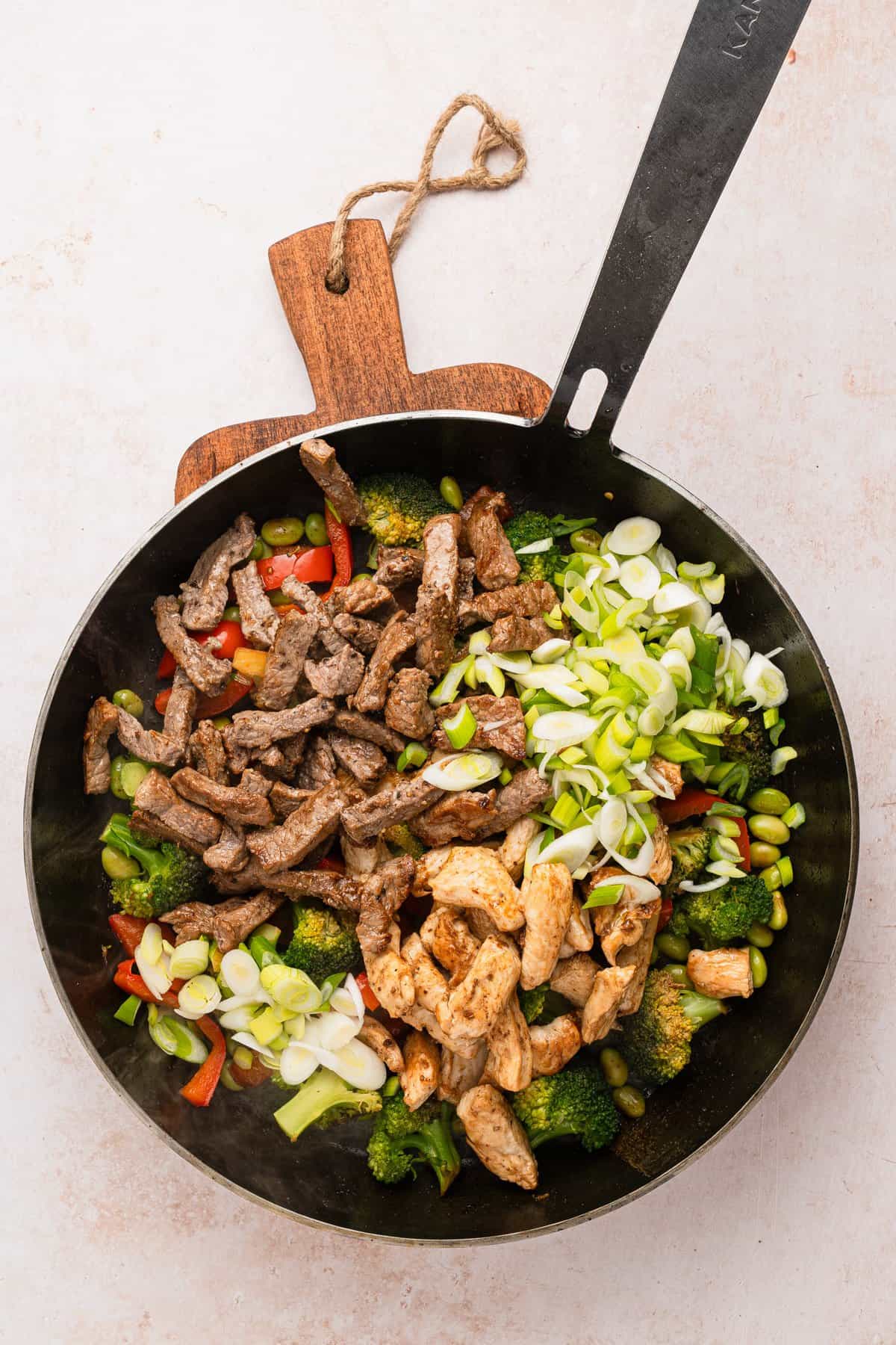 All the cooked ingredients added to the skillet.