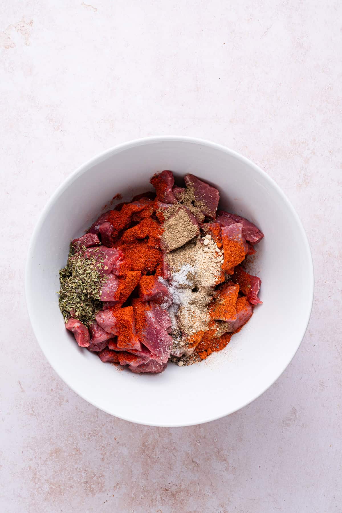 Mix cut steak with seasoning mix.