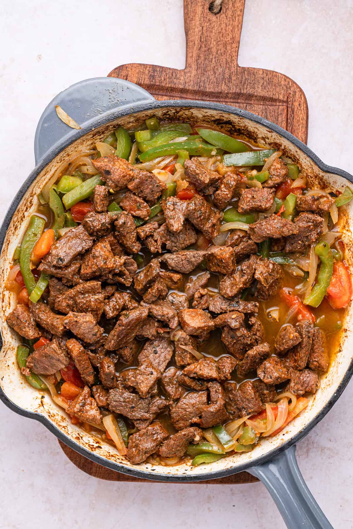 Cooking steak and vegetables together.