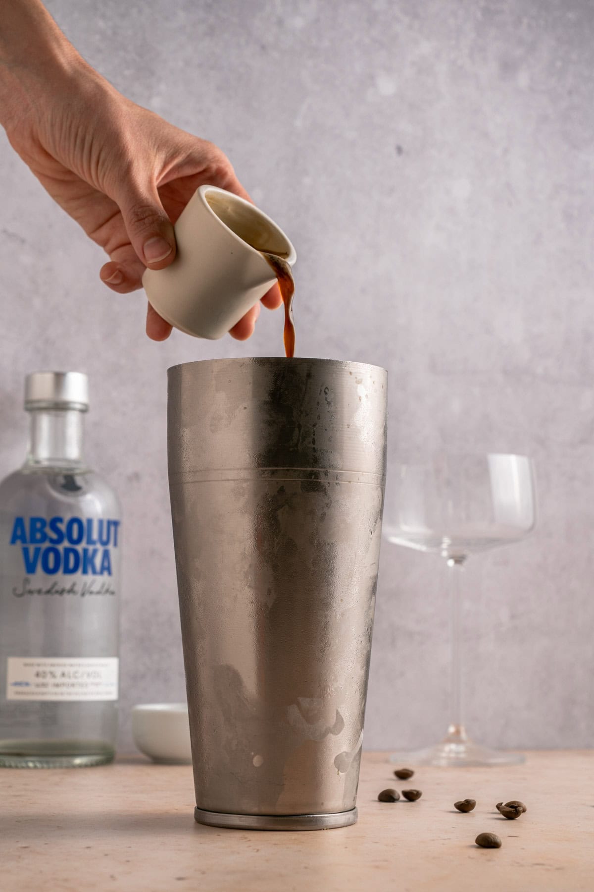 Add espresso to cocktail shaker.