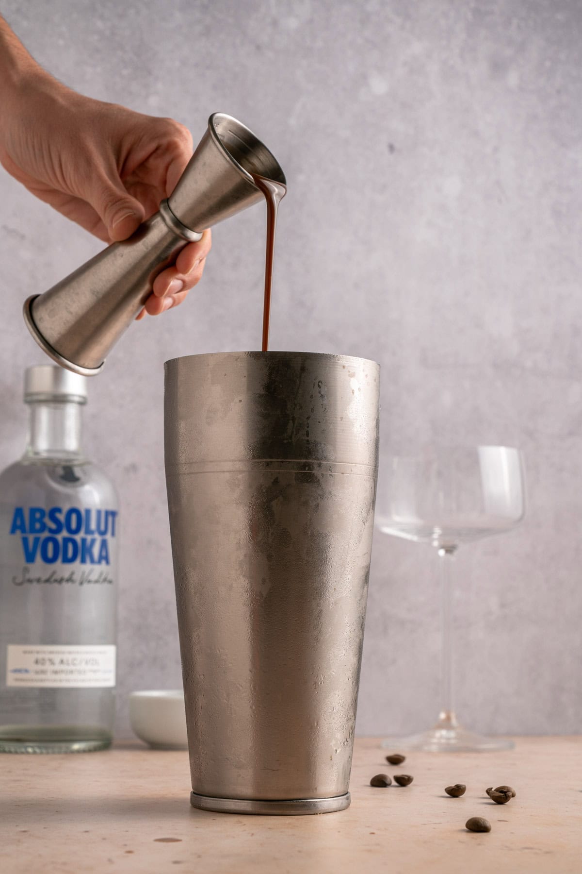 Adding chocolate liqueur to cocktail shaker.