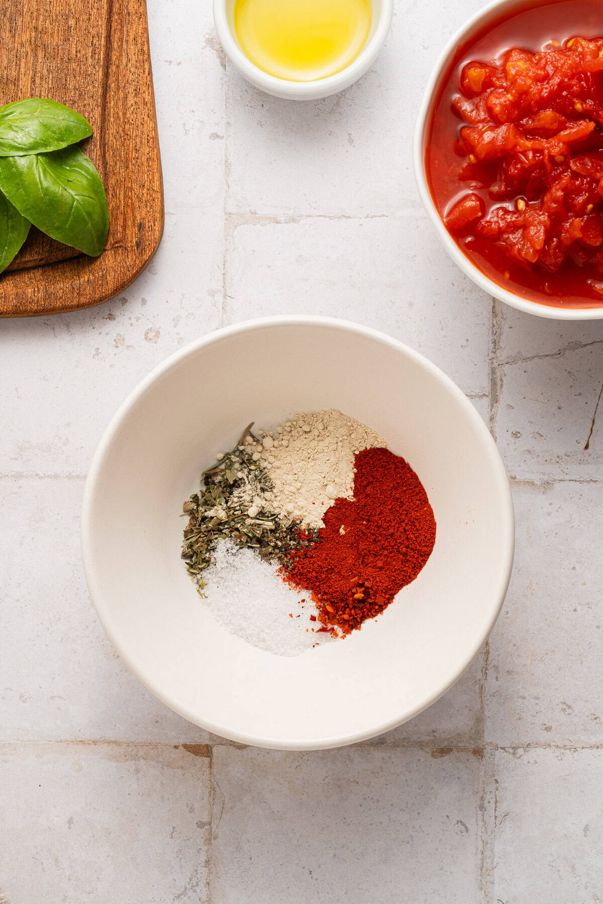 Mixing the seasonings for the chicken.