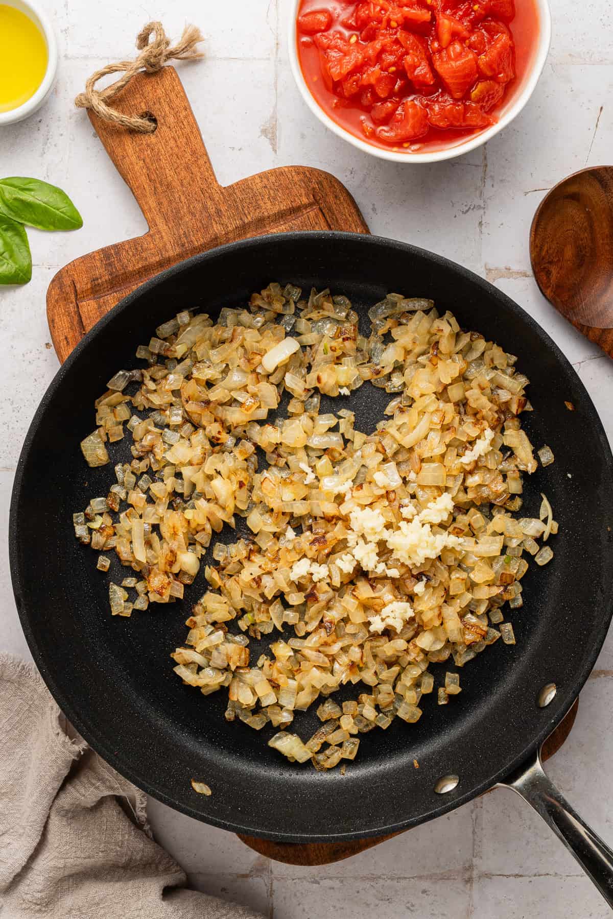 Cooking onions and garlic in skillet.