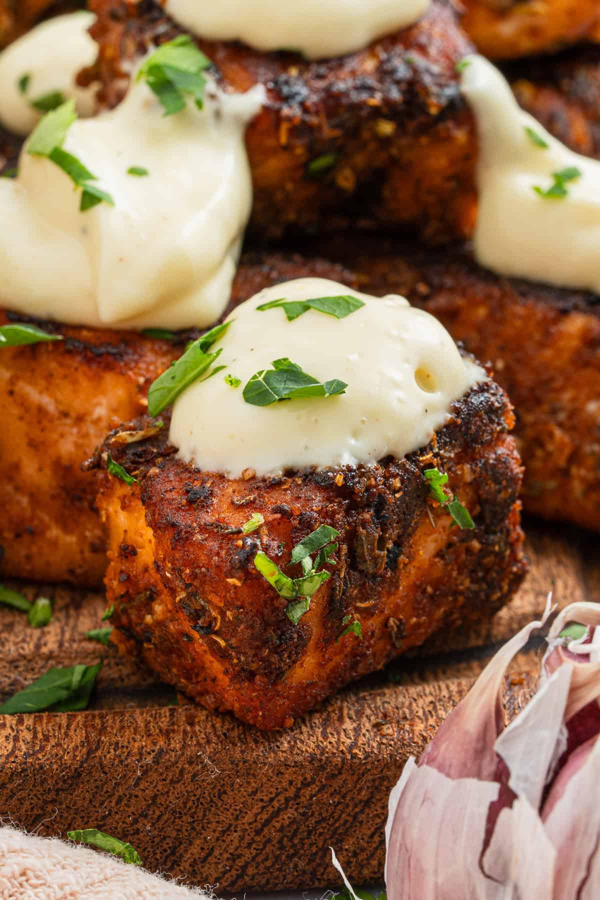 Salmon bites with aioli on top.