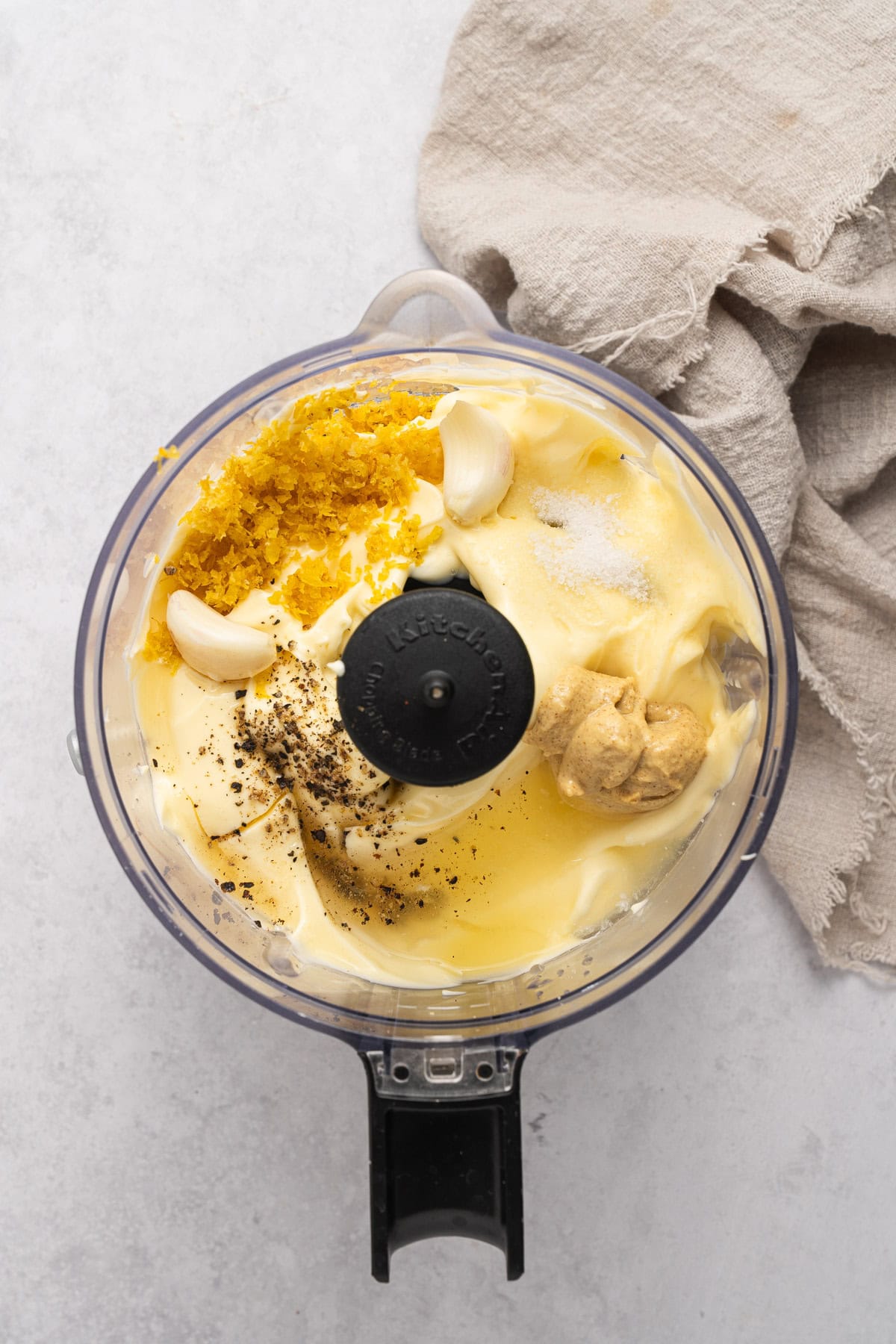 Aioli ingredients in a food processor.