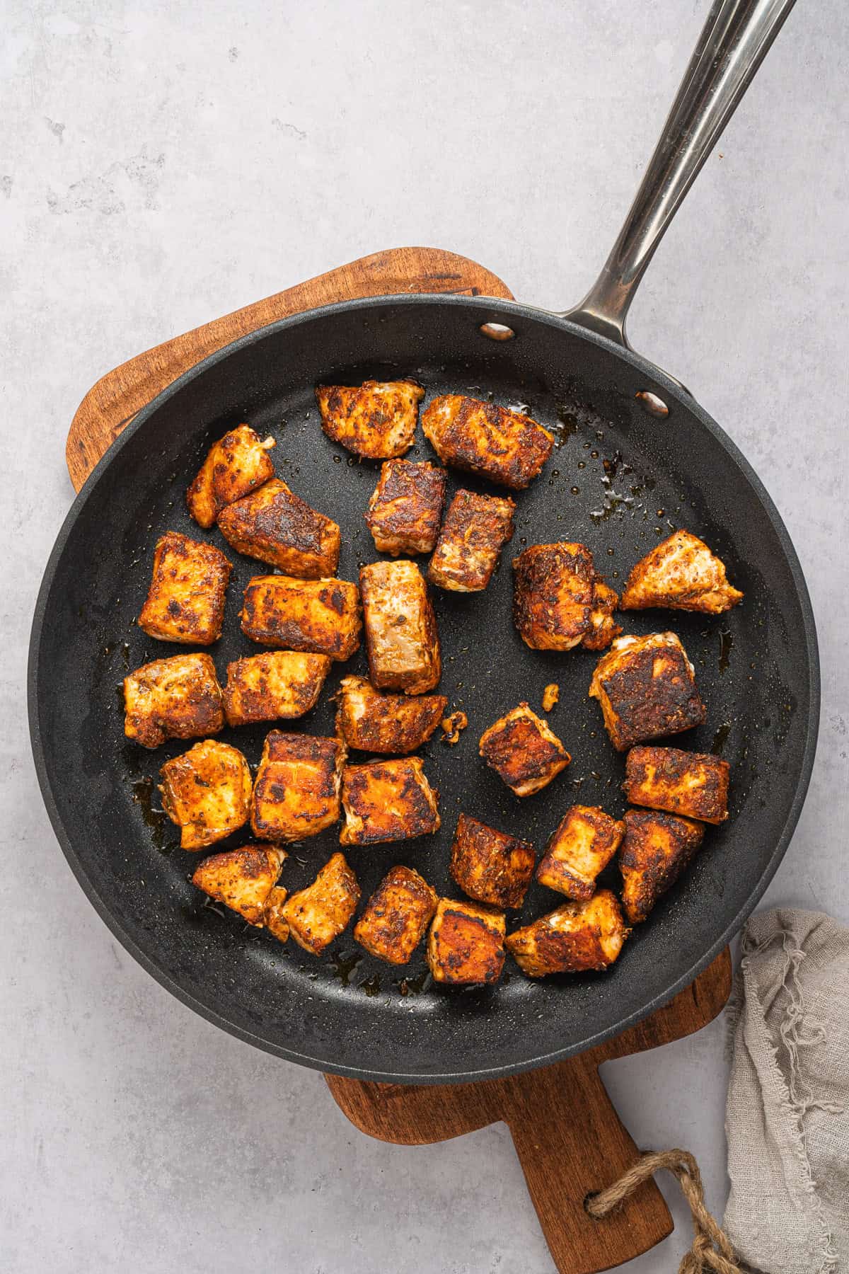 Cooking salmon in a skillet.