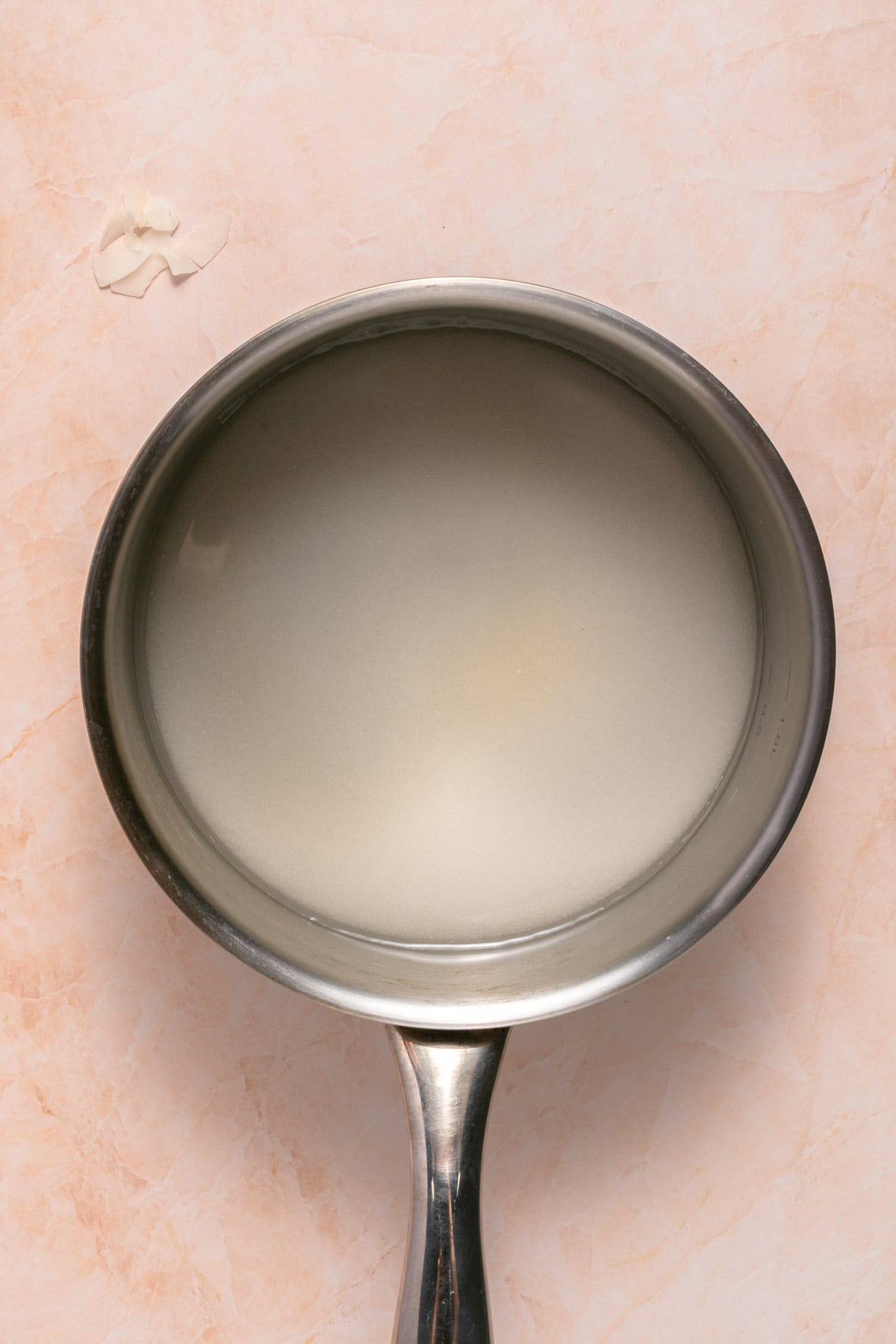 Disolve sugar and water in a pan.