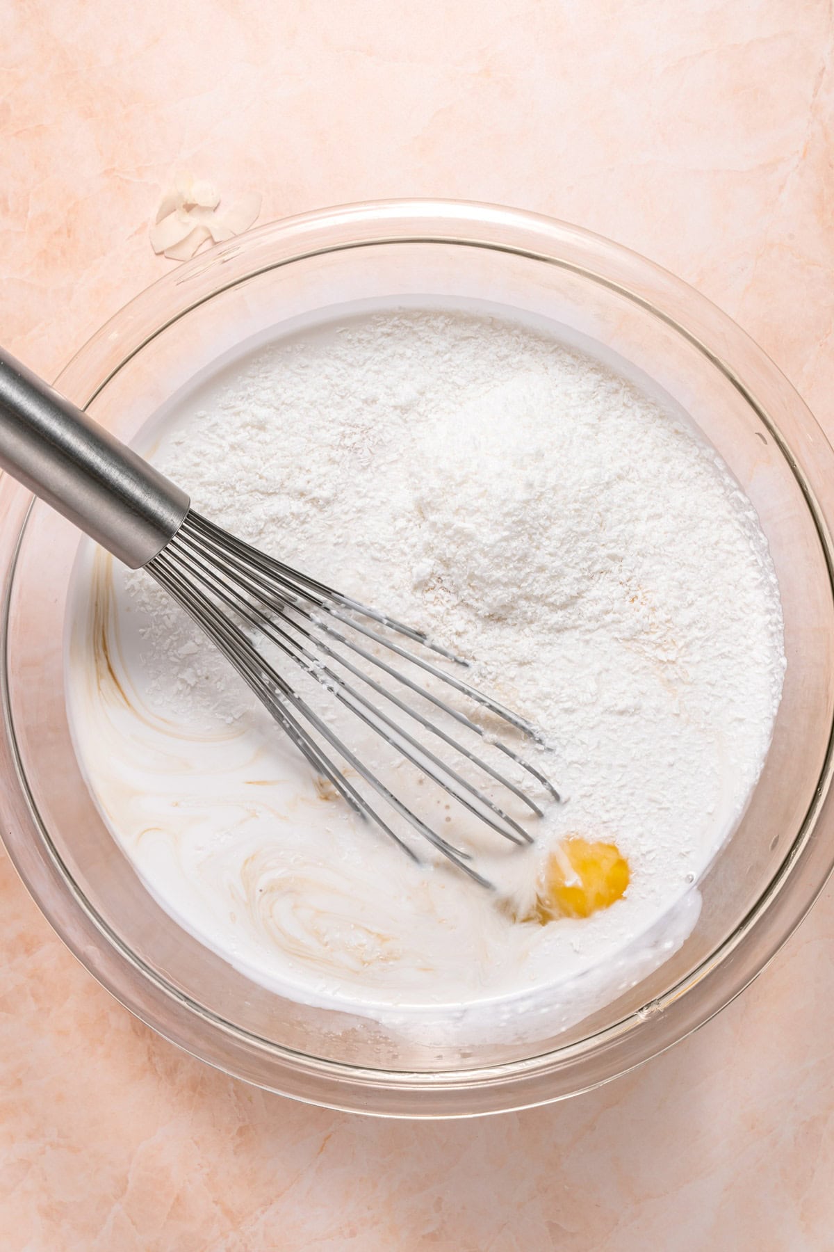 Mixing custard ingredients in a bowl.
