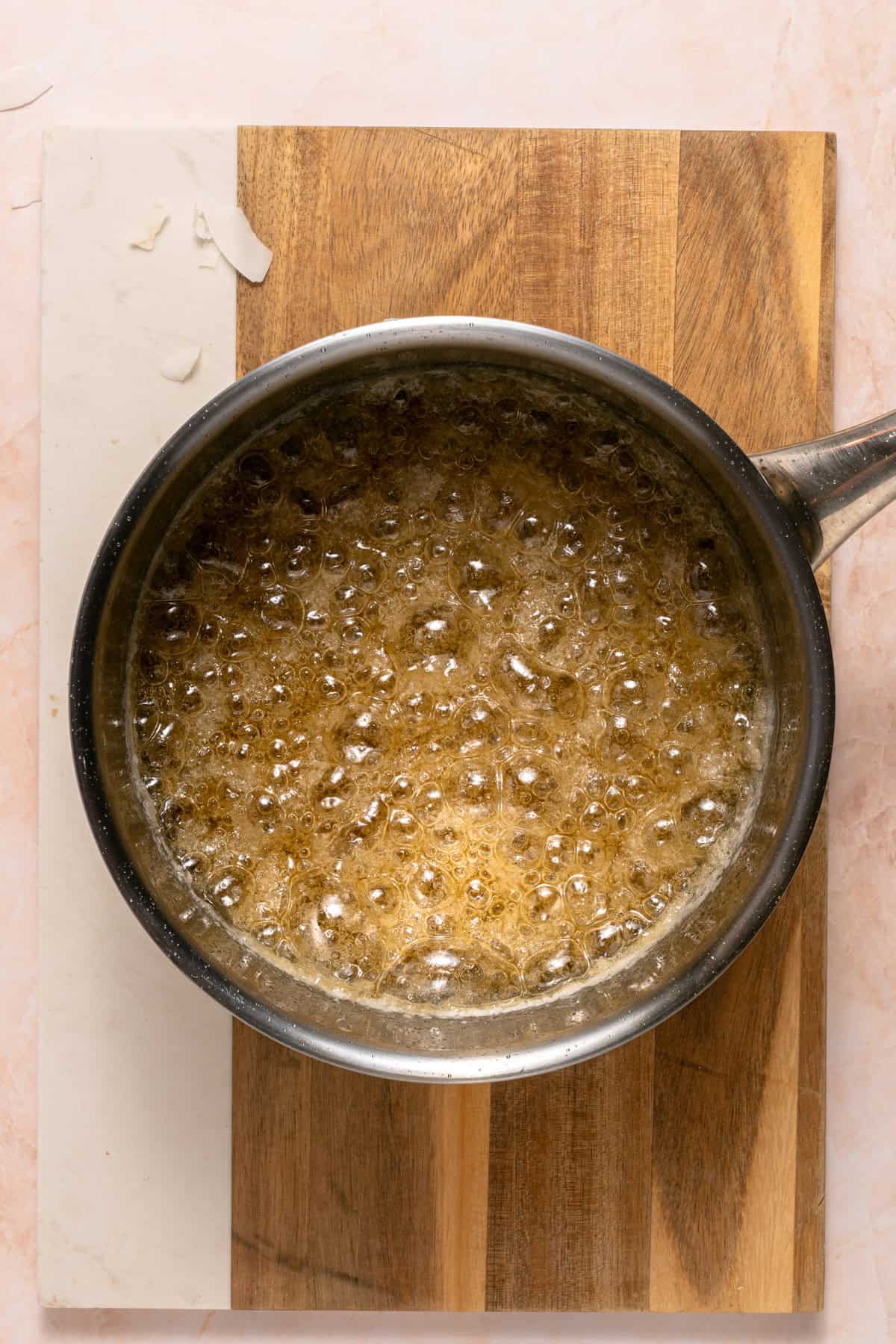 Making caramel sauce in a stainless steel pan.