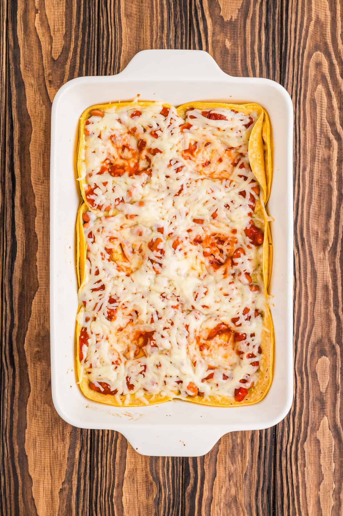 Small divots made to place eggs in the casserole.