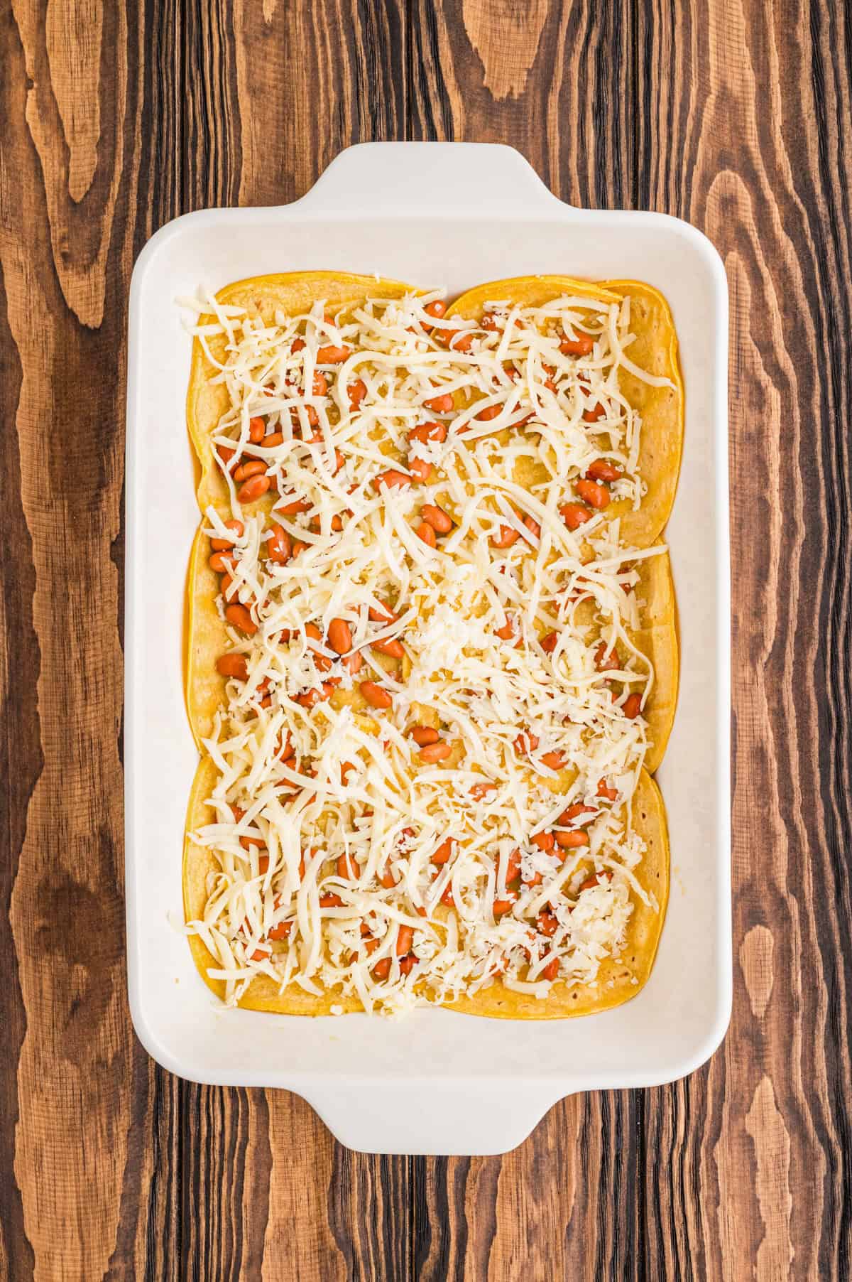 Cheese layered in baking dish.