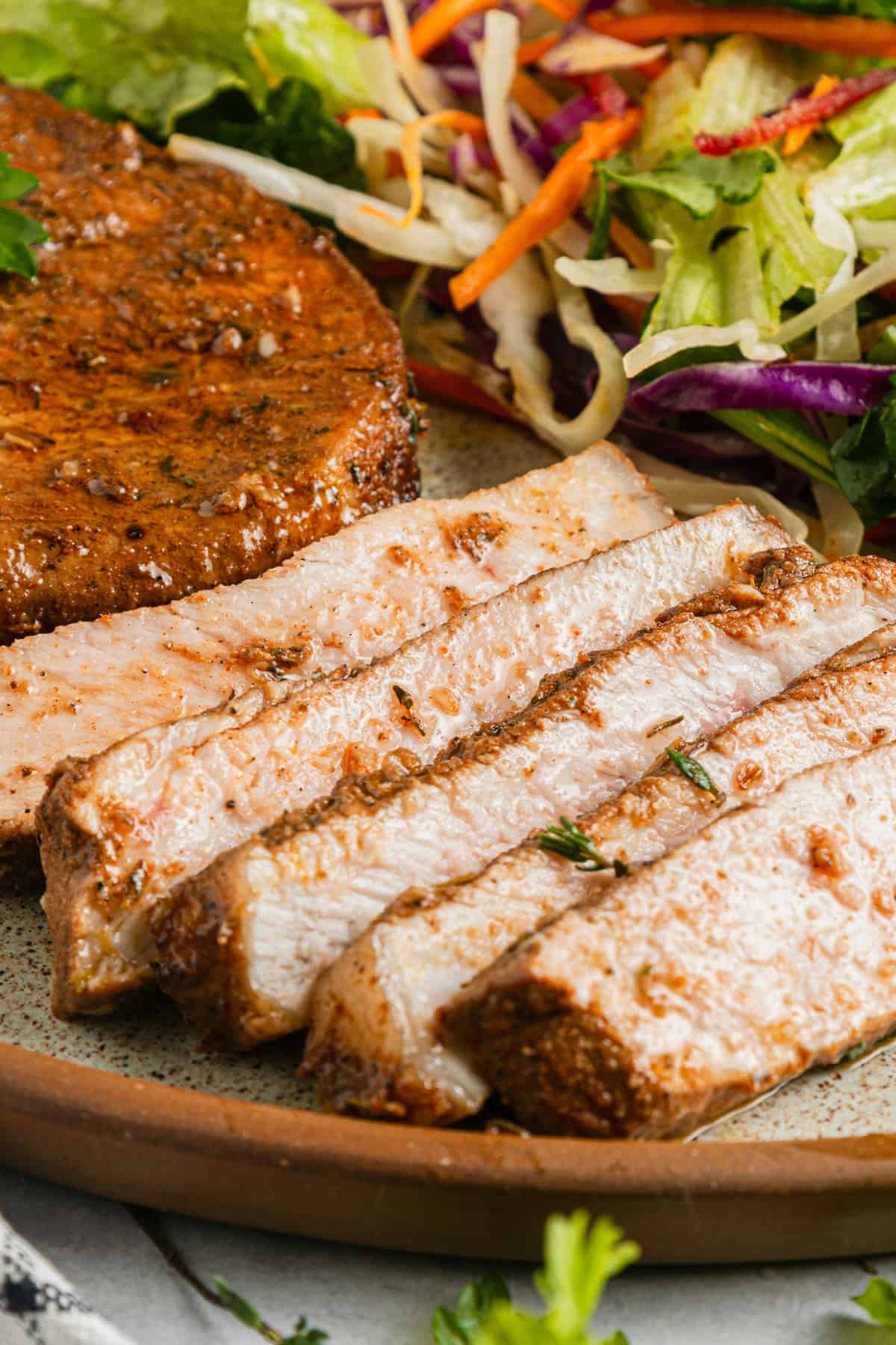 Sliced pork chop on a plate.
