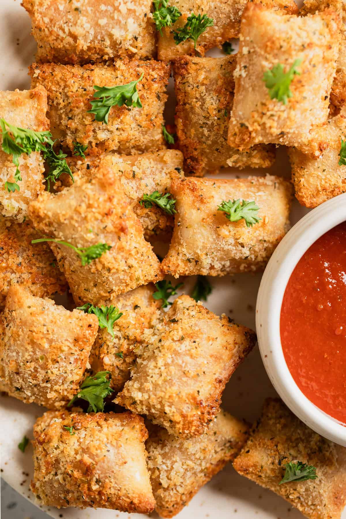 A plate full of pizza rolls.