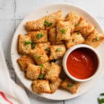 Totinos pizza rolls made in the air fryer on a plate.