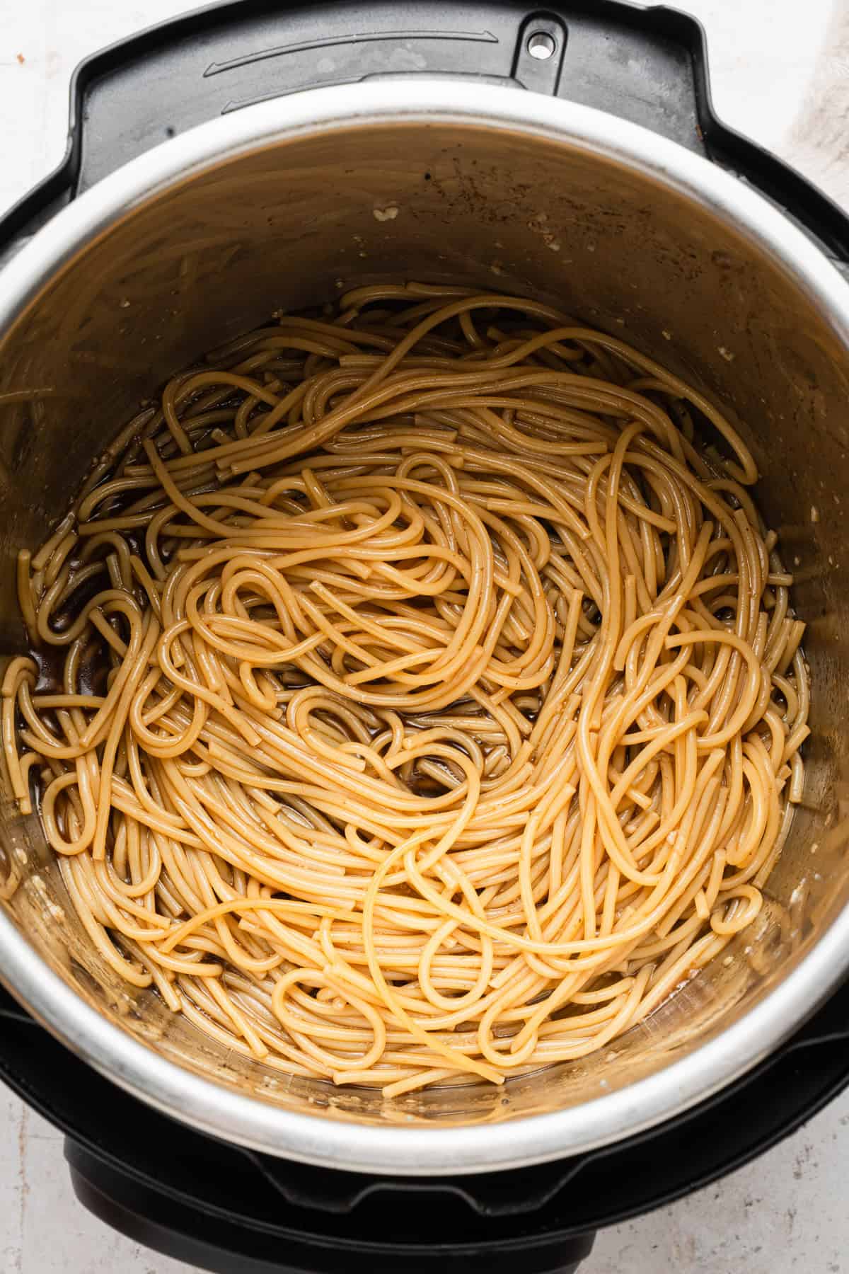 Soy sauce added to cooked noodles.