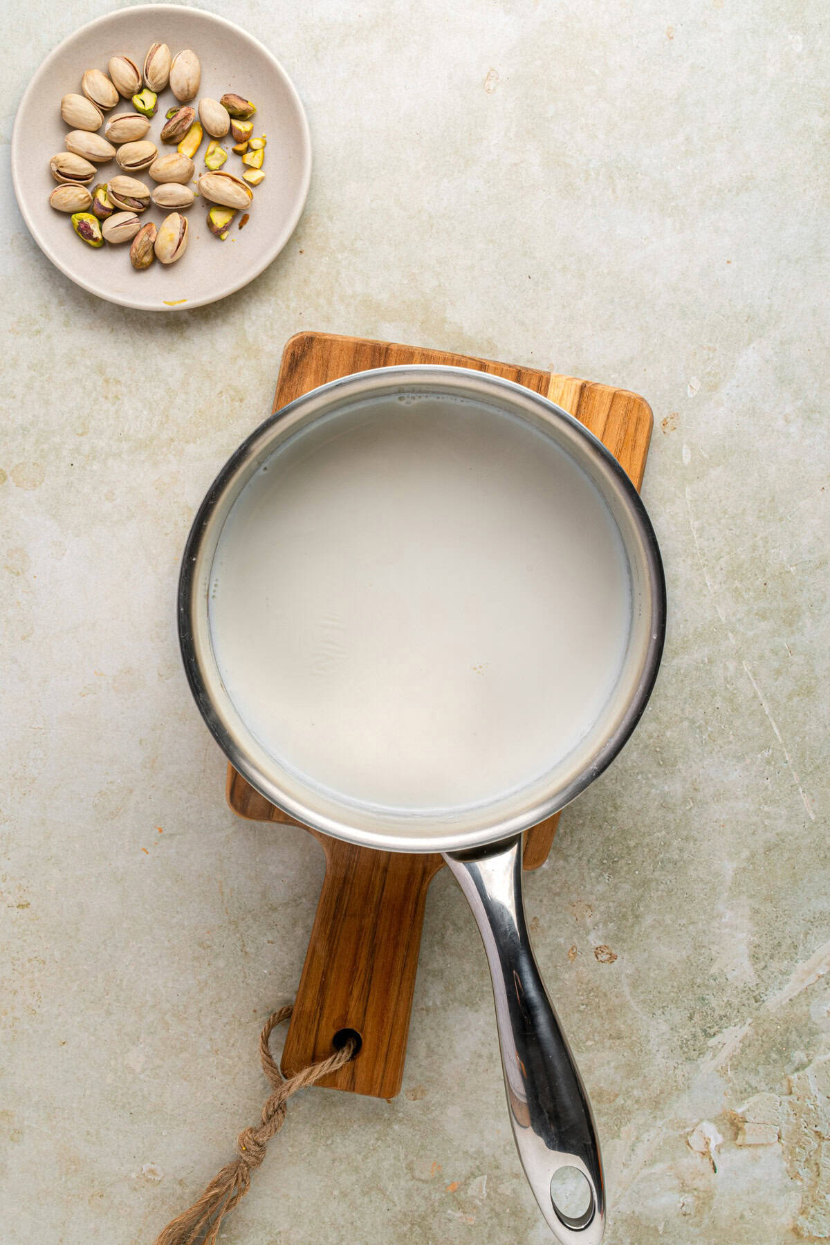 Heated milk in a saucepan.