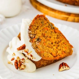 Carrot bundt cake slice on a plate.