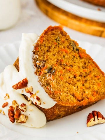 Carrot bundt cake slice on a plate.
