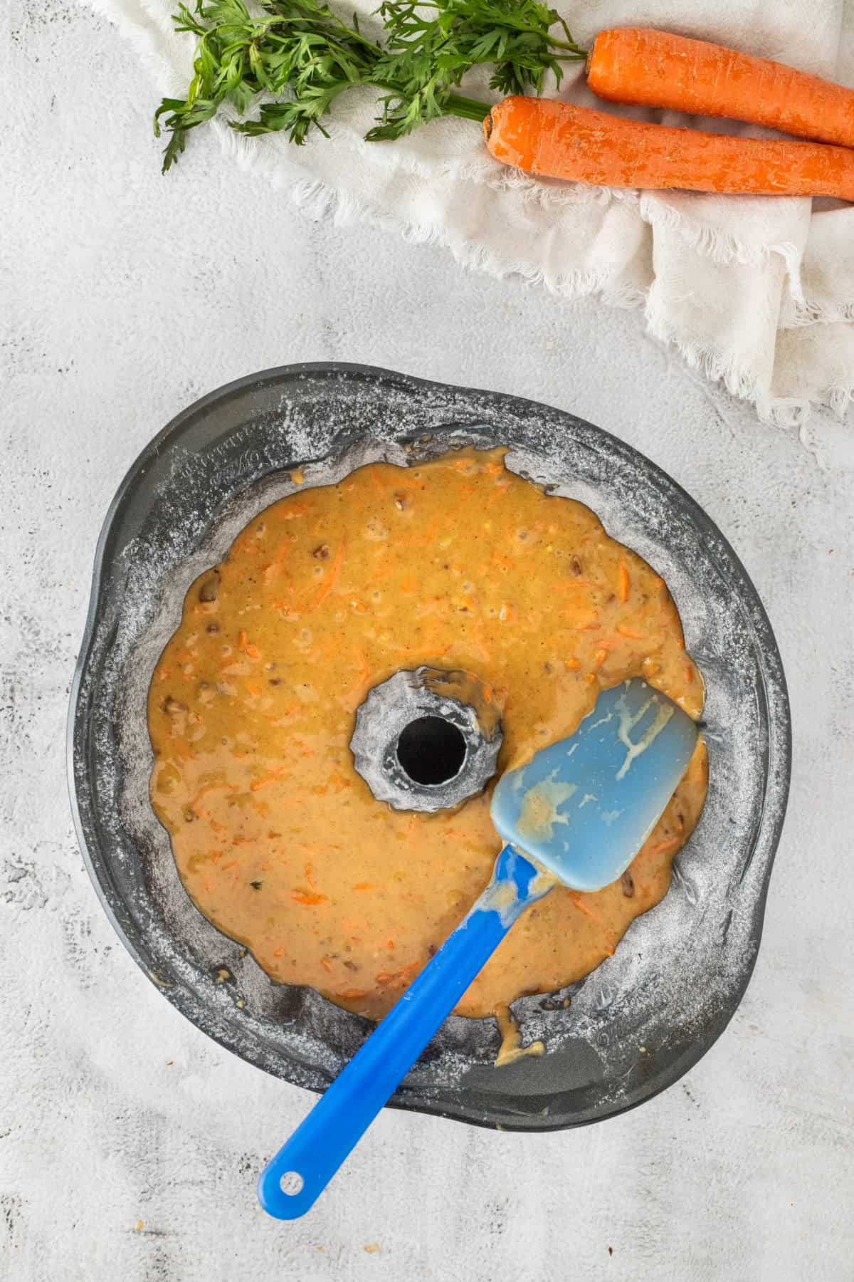 Carrot cake batter in bundt pan.